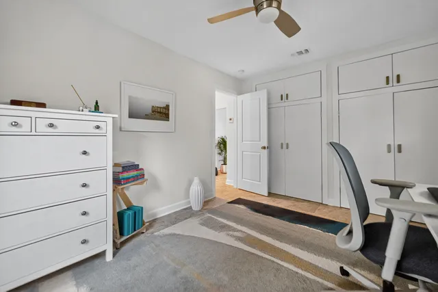 a view of room with stairs and furniture