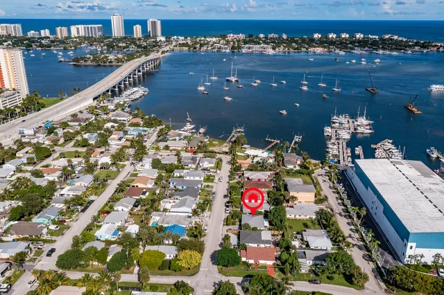 an aerial view of a house with a lake view