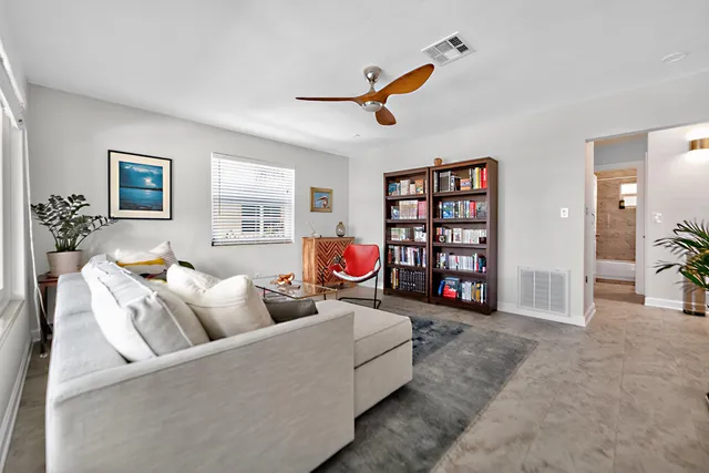 a living room with furniture and window