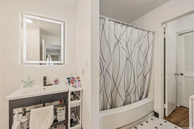 a bathroom with a sink and a mirror