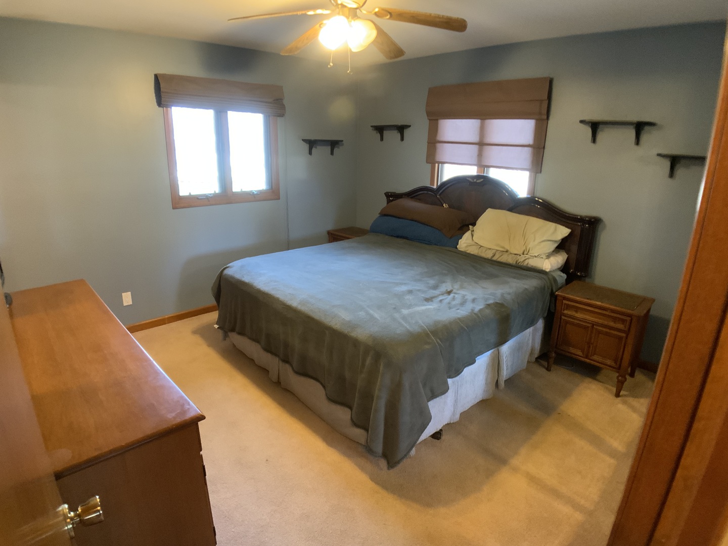 12628 Willow Lane Genoa, IL 60135 - Photo 15 of 21 a bedroom with a bed and dresser