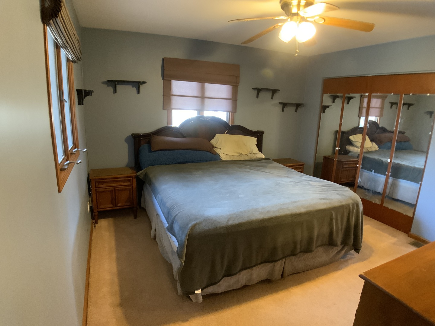 12628 Willow Lane Genoa, IL 60135 - Photo 16 of 21 a bedroom with a bed and a chandelier