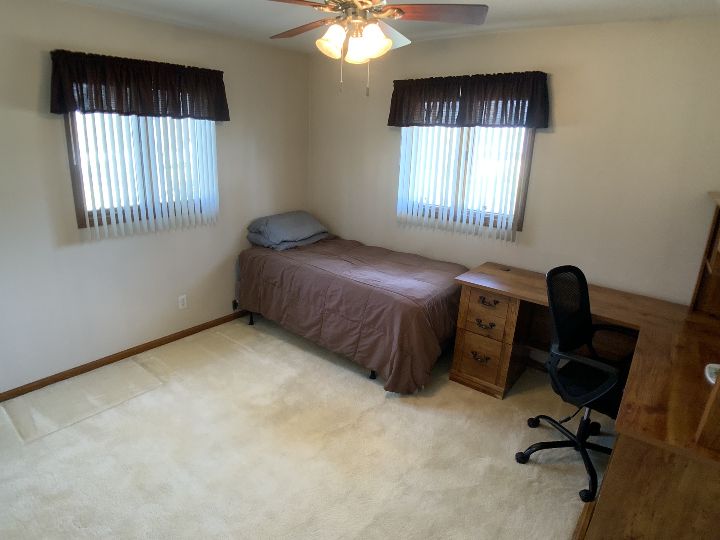 12628 Willow Lane Genoa, IL 60135 - Photo 19 of 21 a bedroom with a bed and a window