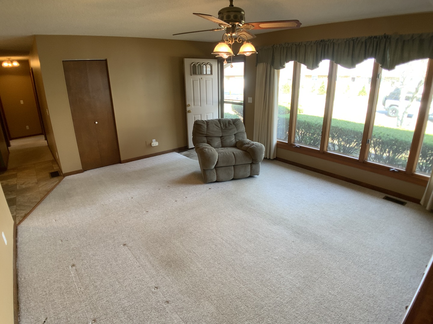 12628 Willow Lane Genoa, IL 60135 - Photo 3 of 21 a living room with furniture and a large window