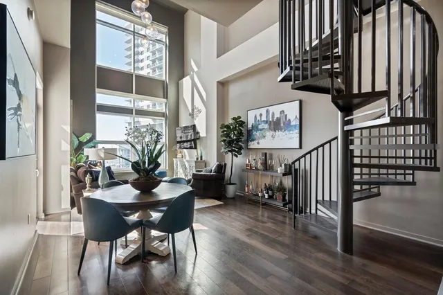 a dining room with furniture and wooden floor