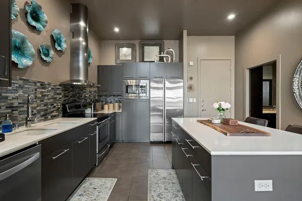 a kitchen with a sink stove and refrigerator