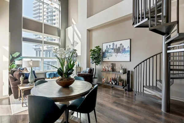 a view of a dining room with furniture window and wooden floor