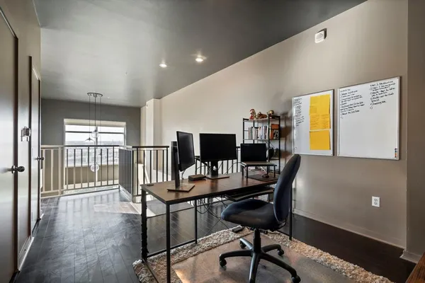 a workspace with furniture and window