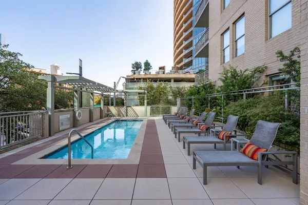 a view of a patio with a table and chairs