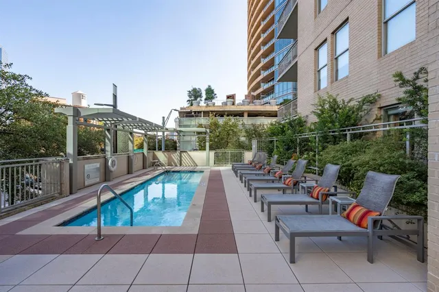 a view of a patio with a table and chairs