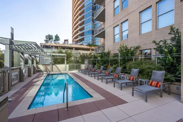 a view of a patio with couches table and chairs and potted plants