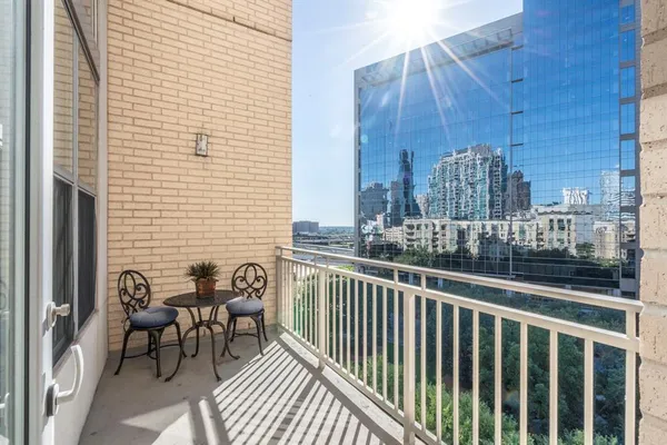 a view of a balcony with furniture