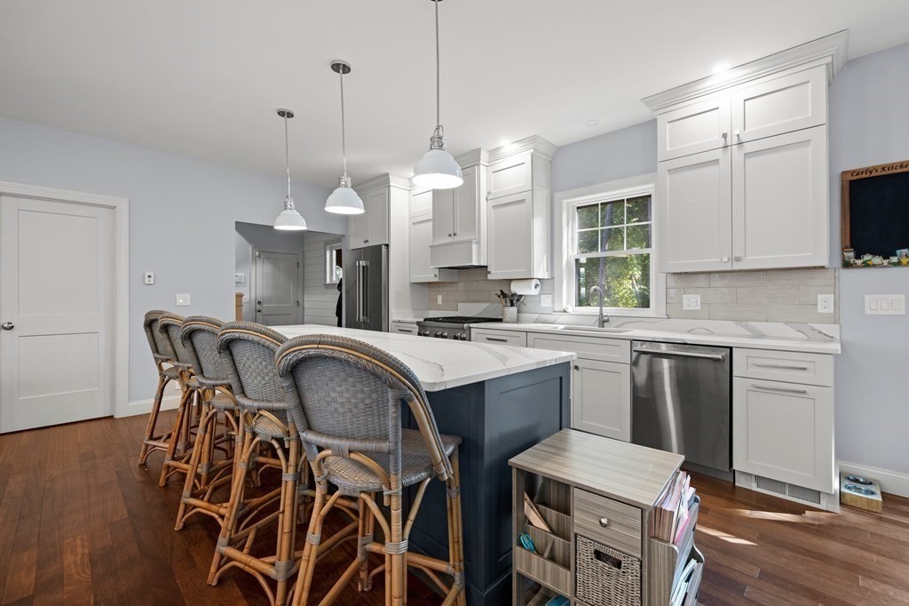 12 Big Rock Road Rye, NH 03870 - Photo 14 of 42 a kitchen with a table chairs sink and cabinets