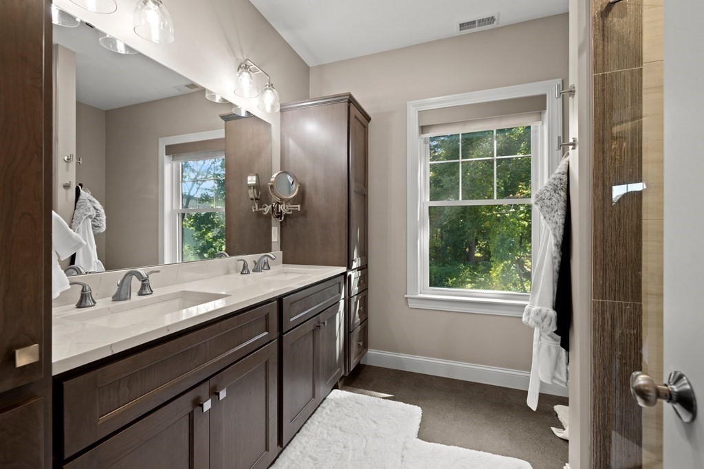 12 Big Rock Road Rye, NH 03870 - Photo 19 of 42 a bathroom with a sink double vanity and a mirror