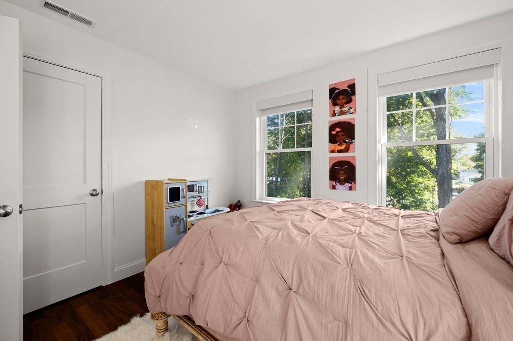 12 Big Rock Road Rye, NH 03870 - Photo 30 of 42 a bedroom with a bed and a window