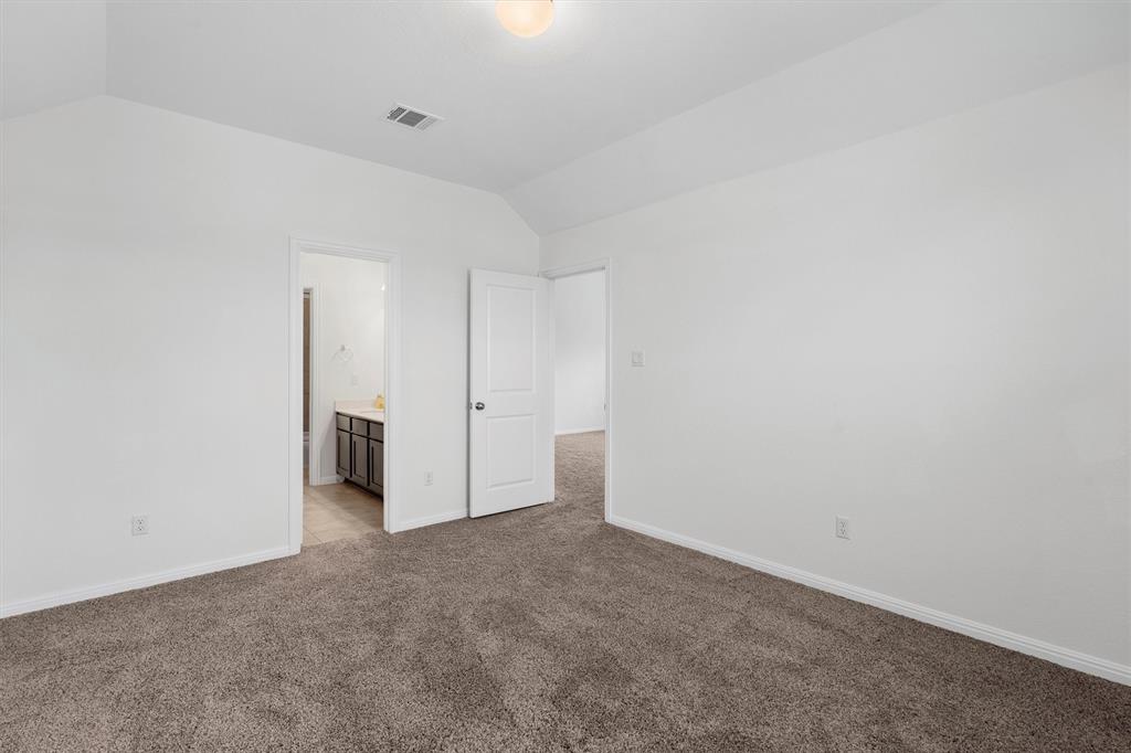 236 Prato Place Georgetown, TX 78628 - Photo 29 of 40 A well-lit bedroom with fresh carpet offers a bright, versatile living space.