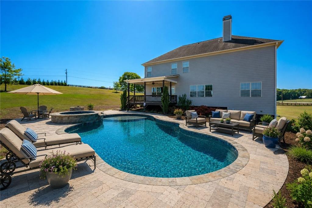 760 Carl Davis Road Northwest Monroe, GA 30656 - Photo 33 of 40 a view of a swimming pool with lounge chairs