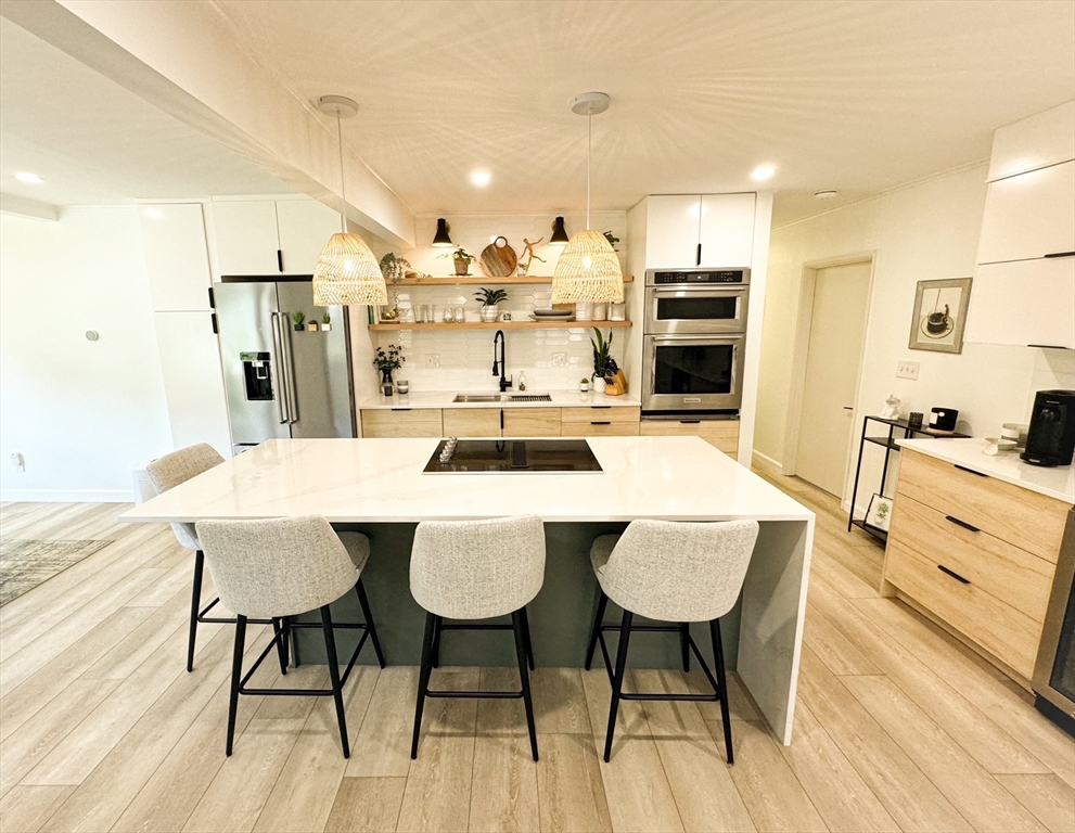 101 Spiers Road Newton, MA 02459 - Photo 1 of 35 a large kitchen with a table and chairs