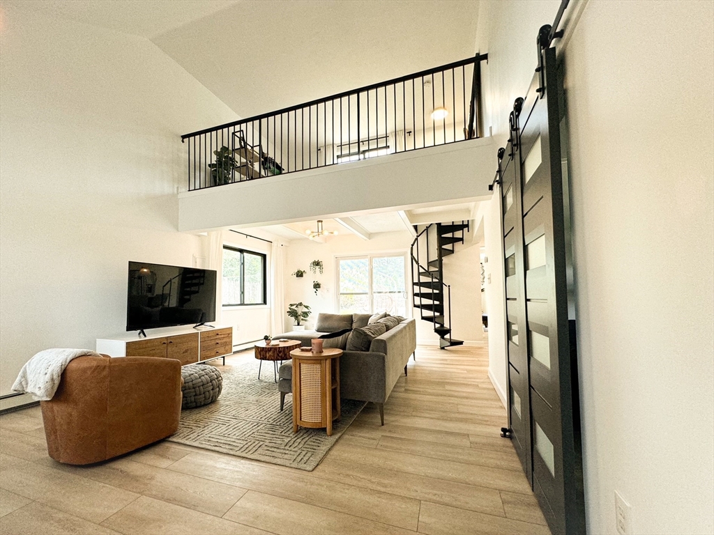 101 Spiers Road Newton, MA 02459 - Photo 11 of 35 a living room with furniture and a flat screen tv