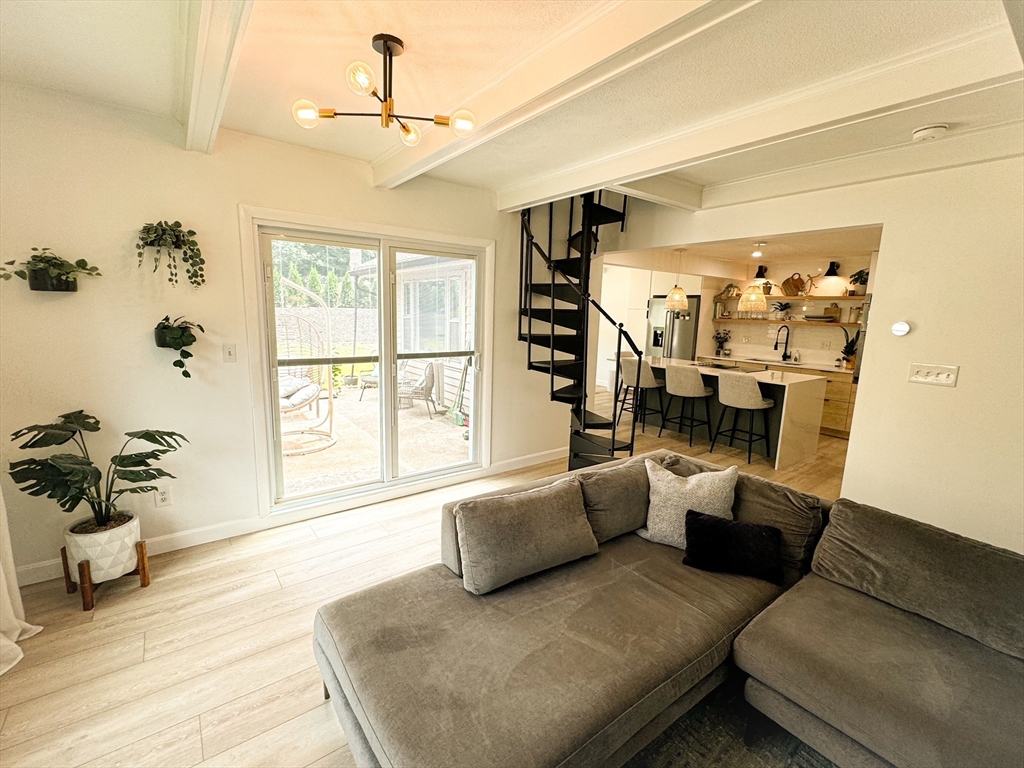 101 Spiers Road Newton, MA 02459 - Photo 12 of 35 a living room with furniture and a large window