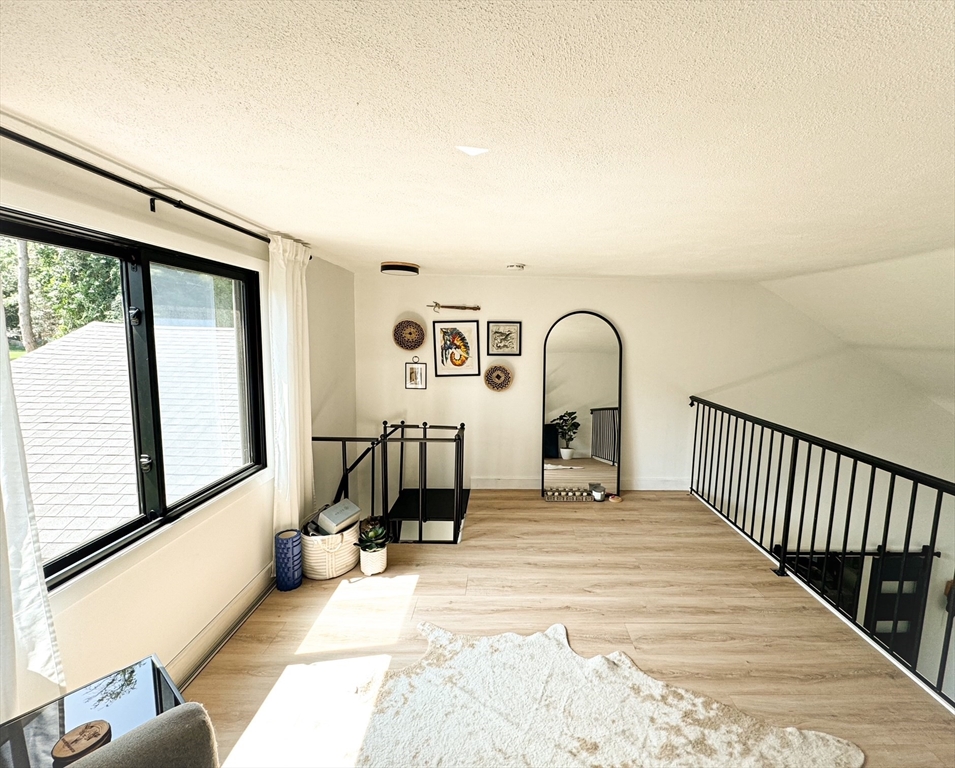 101 Spiers Road Newton, MA 02459 - Photo 15 of 35 a view of a living room and a balcony
