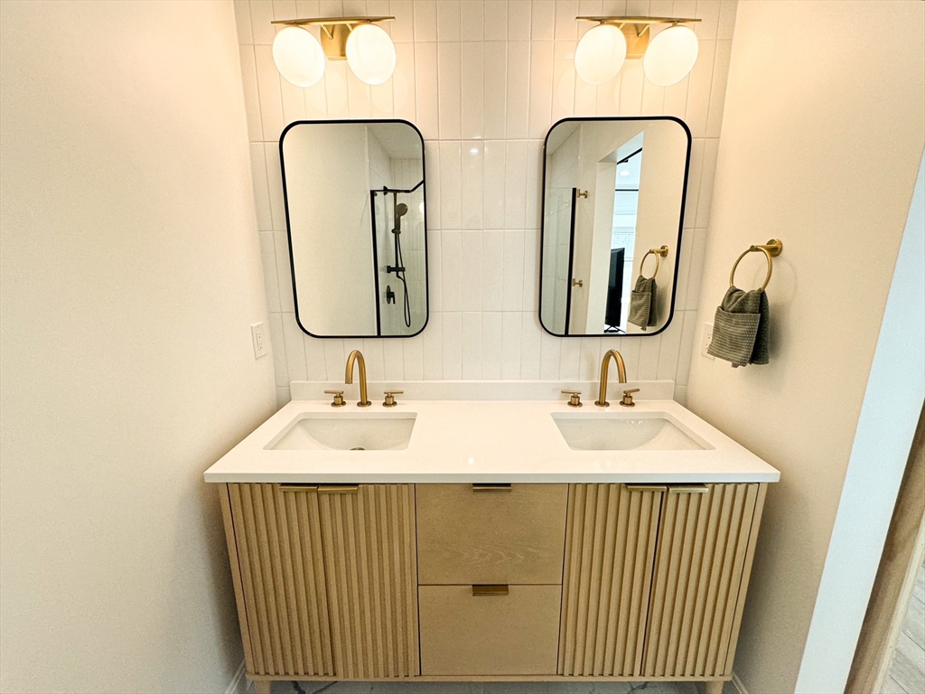 101 Spiers Road Newton, MA 02459 - Photo 20 of 35 a bathroom with a sink and a mirror