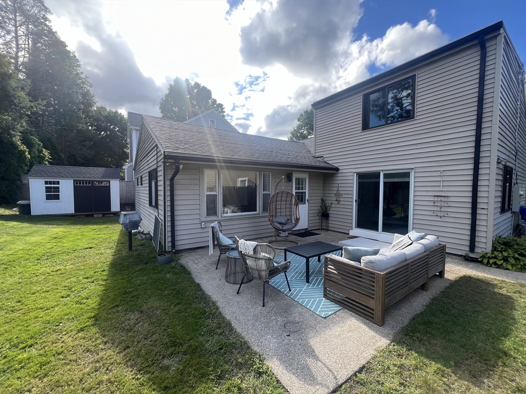 101 Spiers Road Newton, MA 02459 - Photo 30 of 35 a view of a house with a backyard and a patio