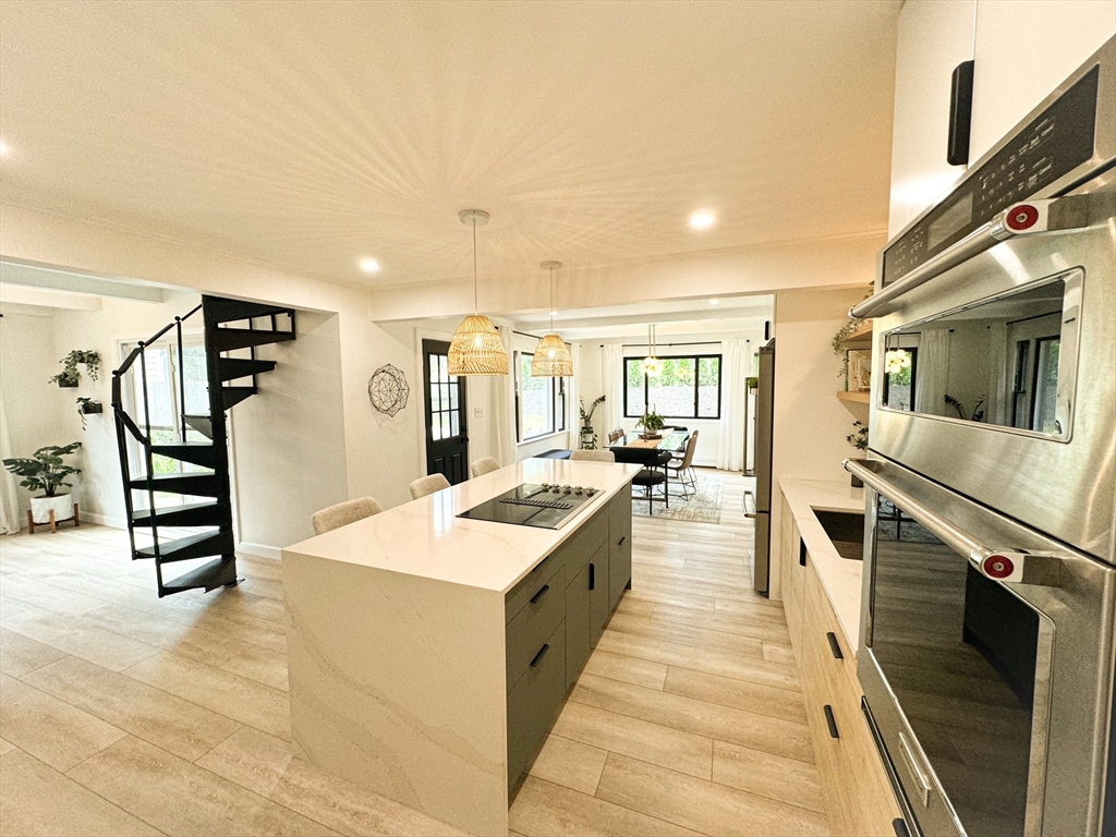 101 Spiers Road Newton, MA 02459 - Photo 3 of 35 a large white kitchen with stainless steel appliances