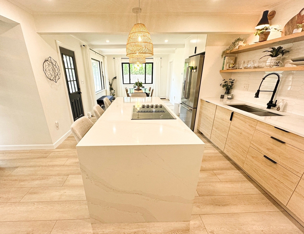101 Spiers Road Newton, MA 02459 - Photo 5 of 35 a large white kitchen with wooden floor
