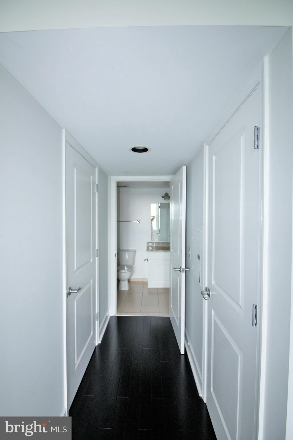 11800 Sunset Hills Road, Unit 625 Reston, VA 20190 - Photo 11 of 32 Bedroom hall to bath, with 2 closets