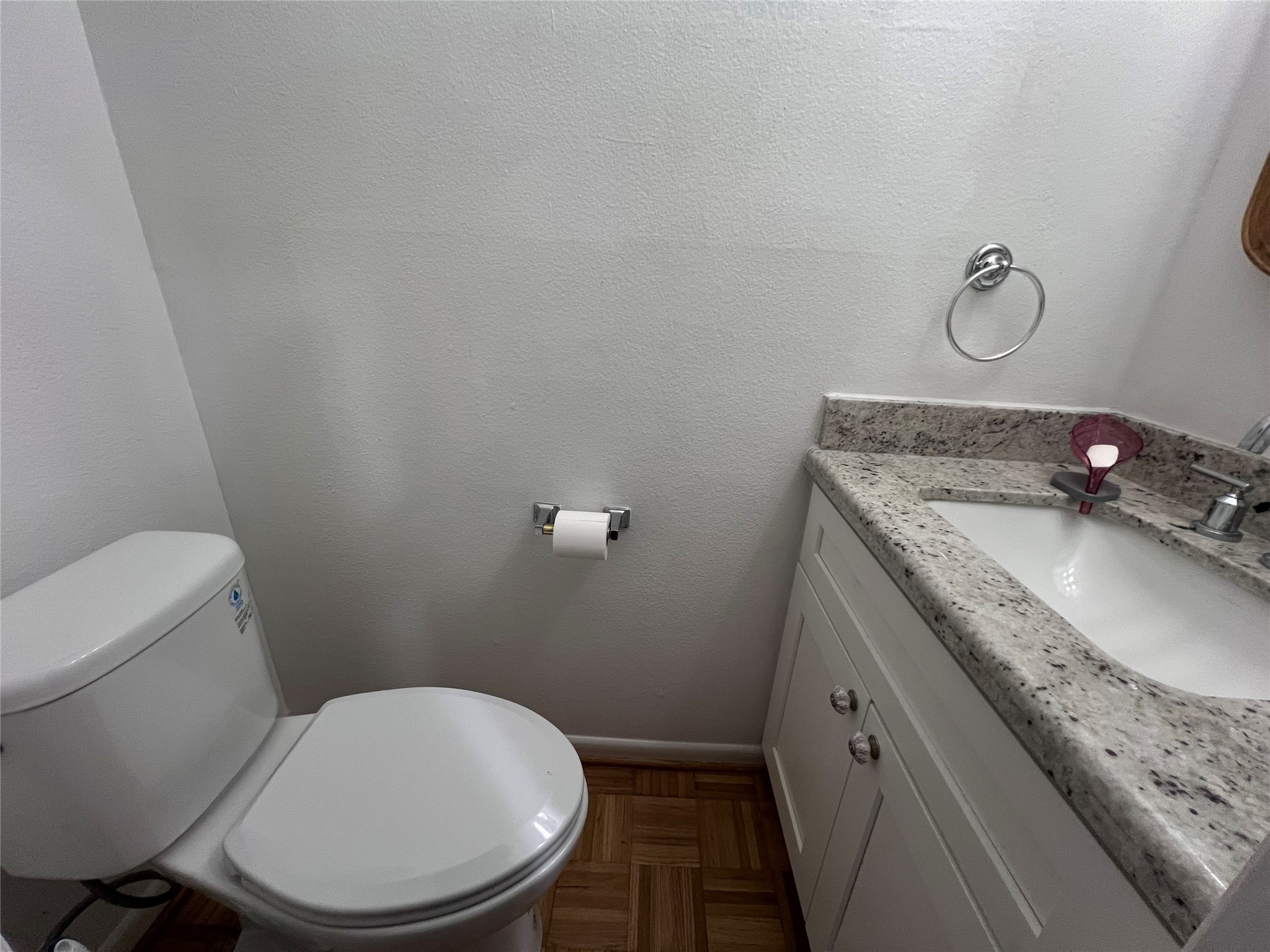 2100 Commonwealth Street, Unit L Houston, TX 77006 - Photo 24 of 30 a bathroom with a granite countertop toilet sink and mirror