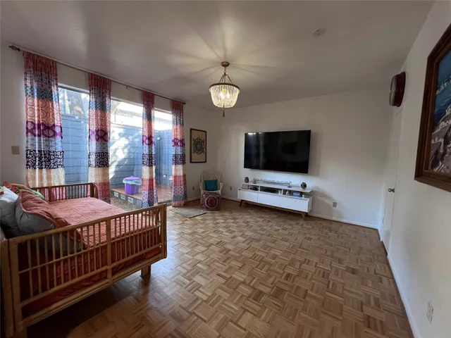 a room with furniture and a flat screen tv