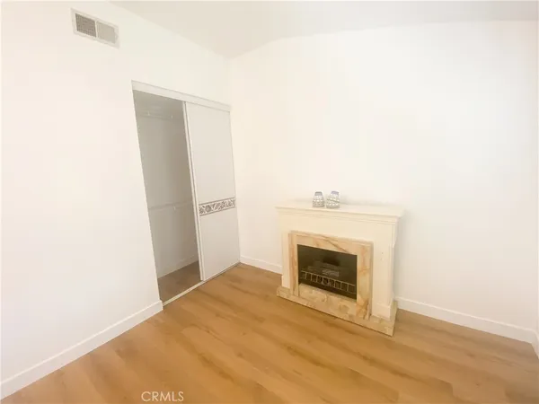 a spacious bathroom with a tub shower and a sink