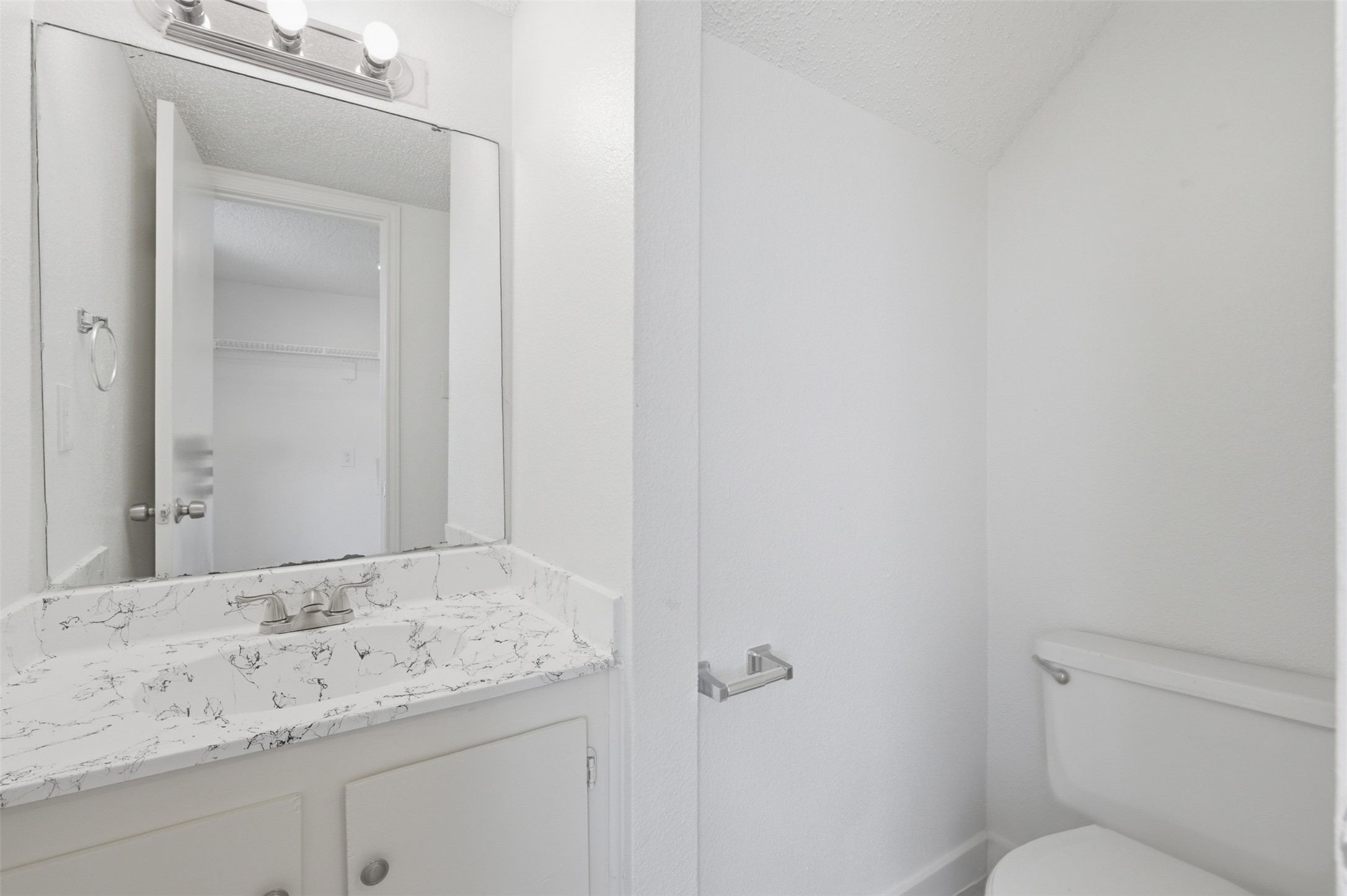 1605 Future Drive, Unit B Austin, TX 78754 - Photo 8 of 13 Bathroom with vanity and a textured ceiling