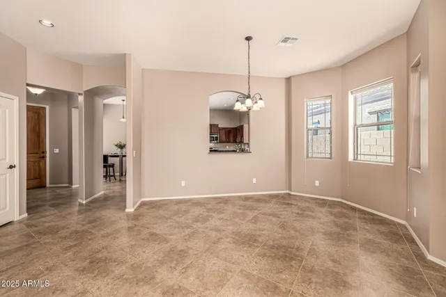 a view of a room with window and hallway