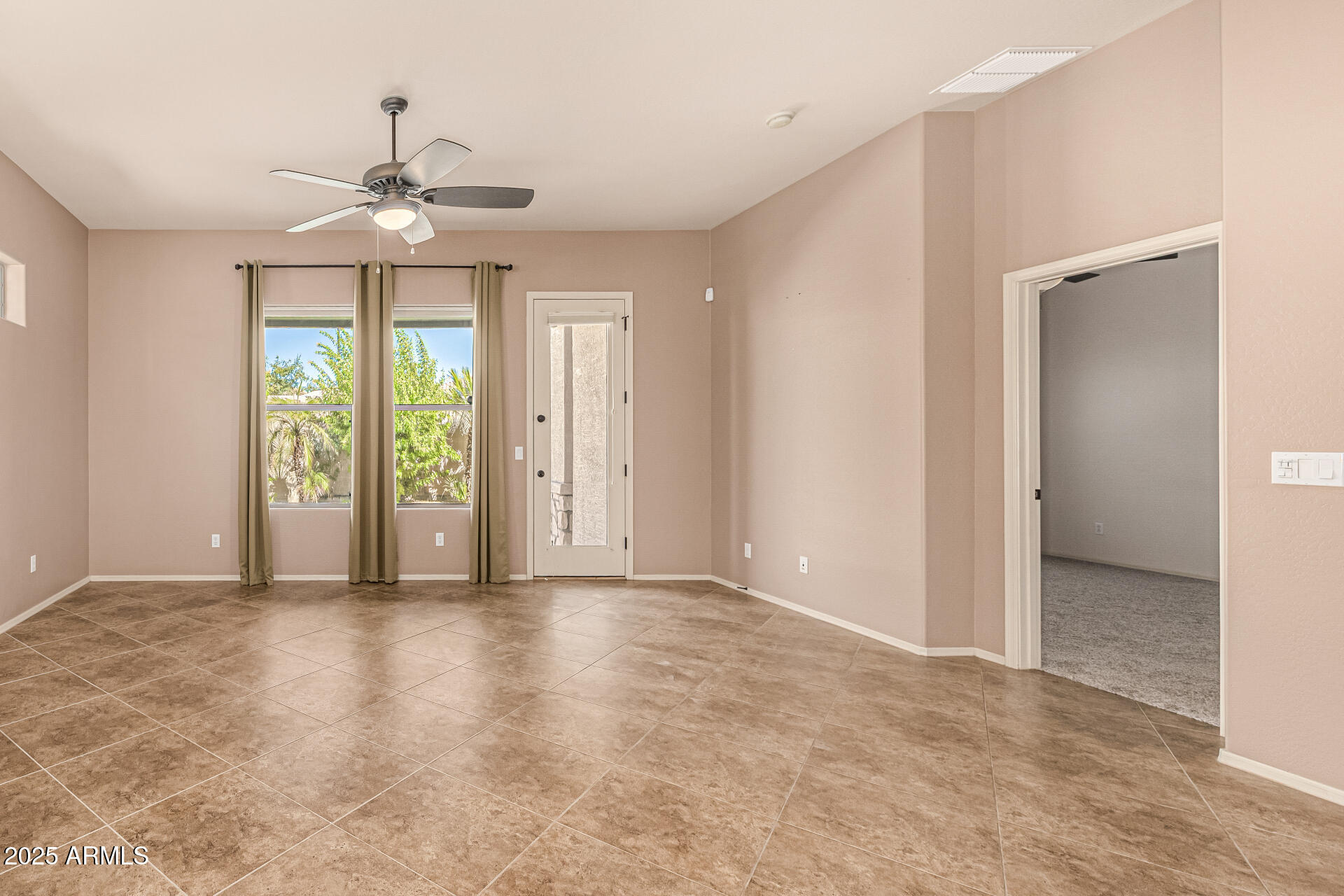 6202 East McKellips Road, Unit 156 Mesa, AZ 85215 - Photo 22 of 57 a view of an empty room with a window