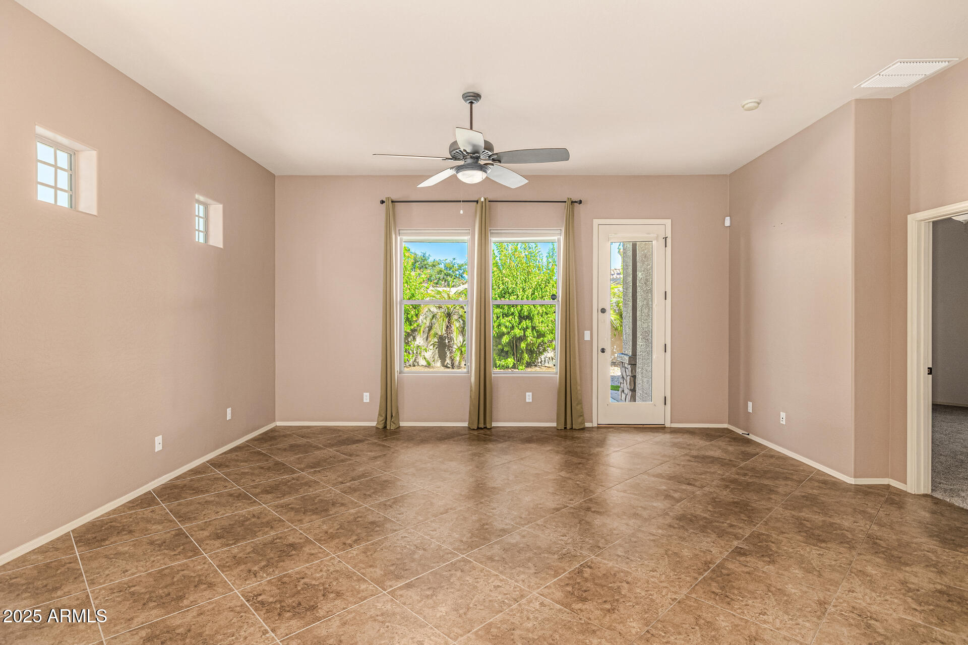 6202 East McKellips Road, Unit 156 Mesa, AZ 85215 - Photo 25 of 57 a view of an empty room with a window