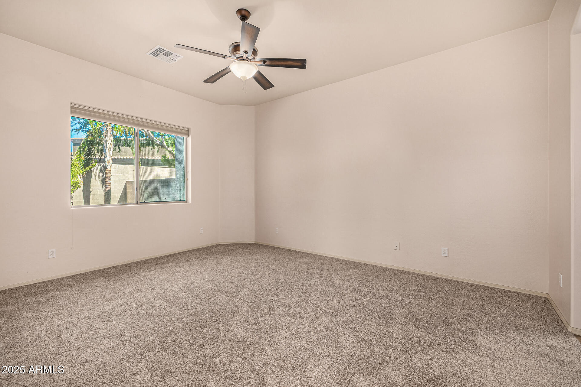 6202 East McKellips Road, Unit 156 Mesa, AZ 85215 - Photo 57 of 57 an empty room with a window