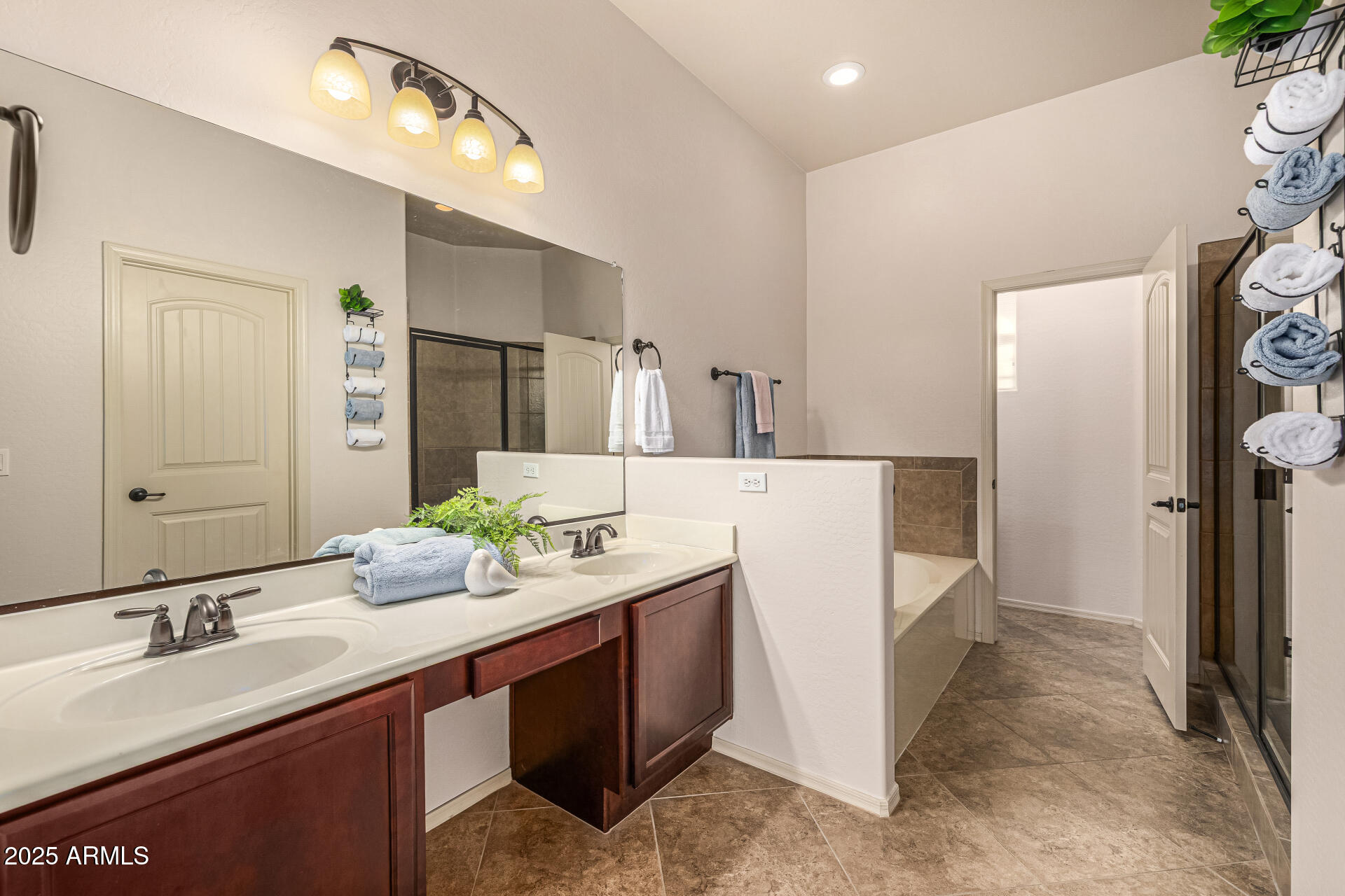 6202 East McKellips Road, Unit 156 Mesa, AZ 85215 - Photo 31 of 57 a bathroom with a sink and a mirror