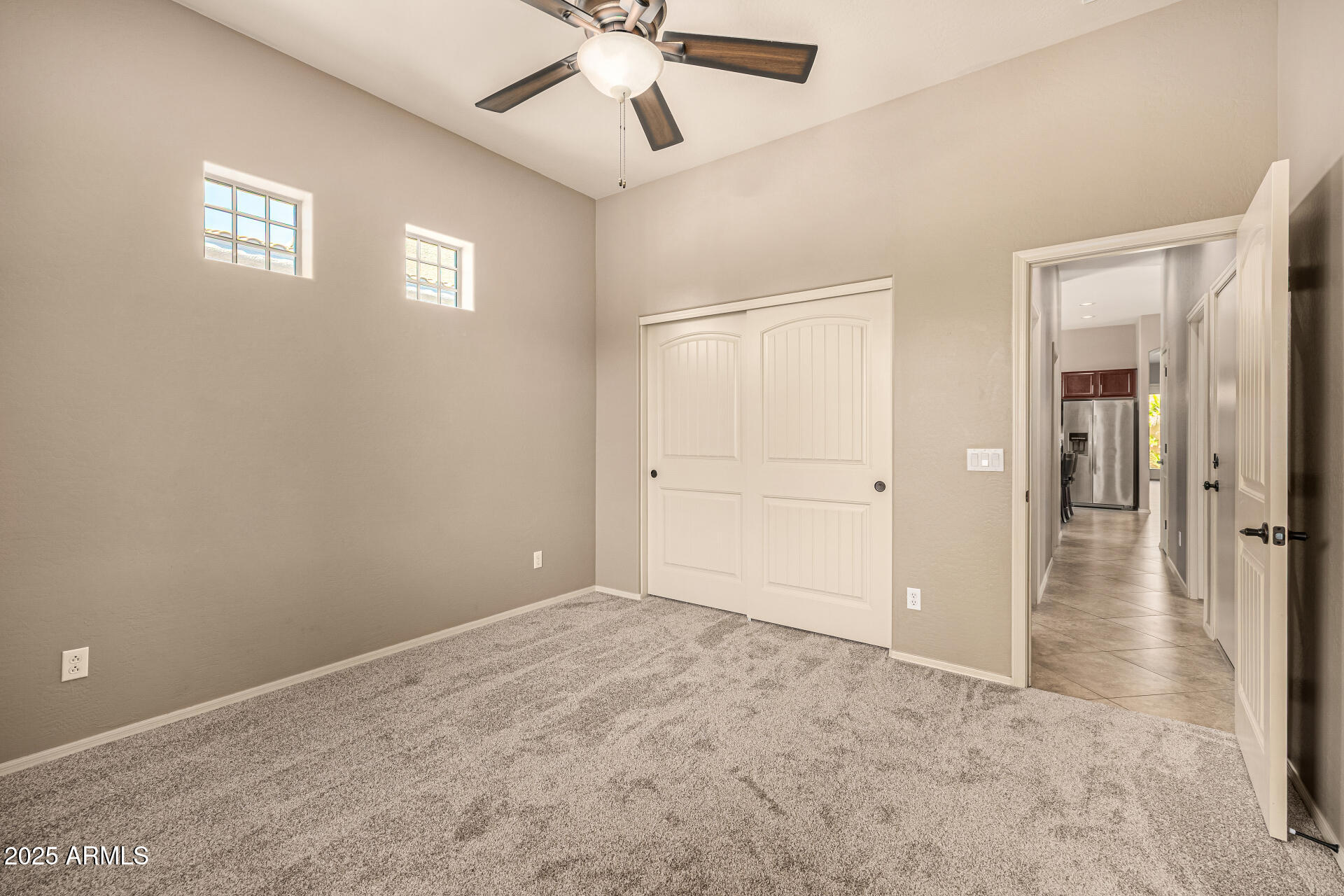 6202 East McKellips Road, Unit 156 Mesa, AZ 85215 - Photo 35 of 57 an empty room with fan and entrance
