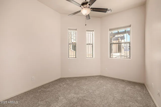 a kitchen with granite countertop cabinets and white appliances