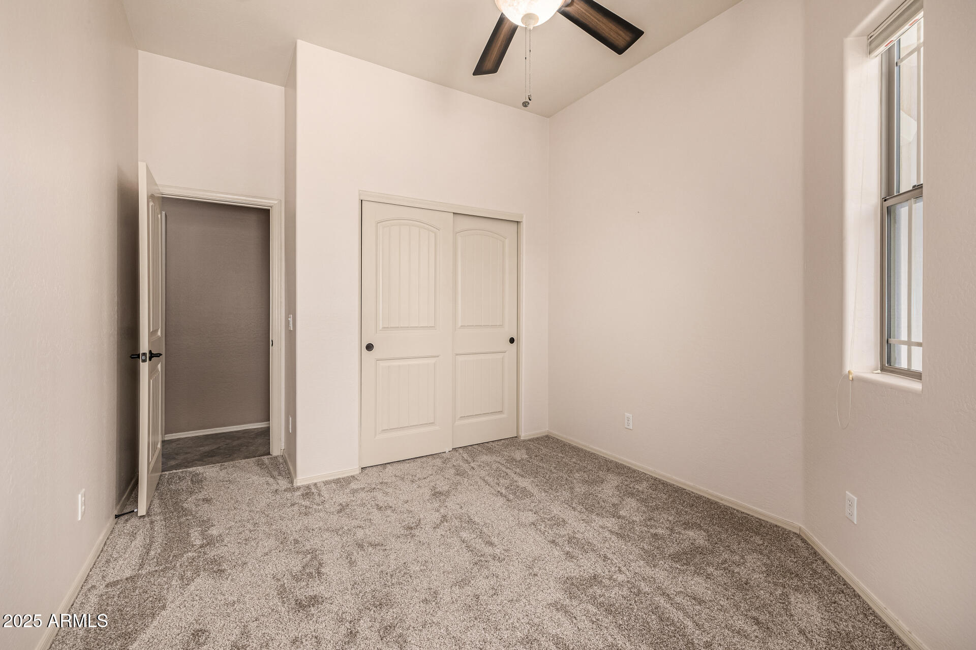 6202 East McKellips Road, Unit 156 Mesa, AZ 85215 - Photo 38 of 57 an empty room with closet and fan