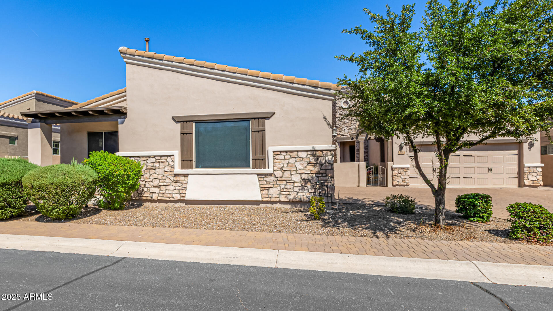 6202 East McKellips Road, Unit 156 Mesa, AZ 85215 - Photo 3 of 57 front view of a house with a small yard
