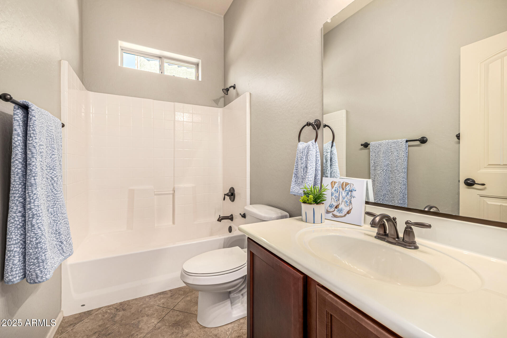 6202 East McKellips Road, Unit 156 Mesa, AZ 85215 - Photo 39 of 57 a bathroom with a granite countertop sink toilet and shower