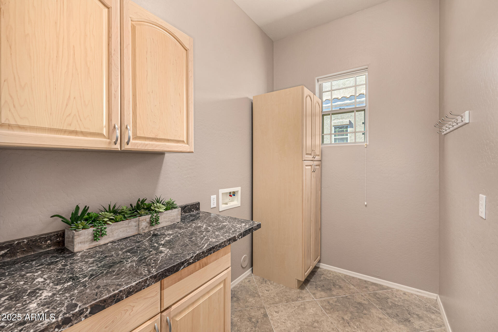 6202 East McKellips Road, Unit 156 Mesa, AZ 85215 - Photo 40 of 57 a kitchen with granite countertop cabinets and white appliances