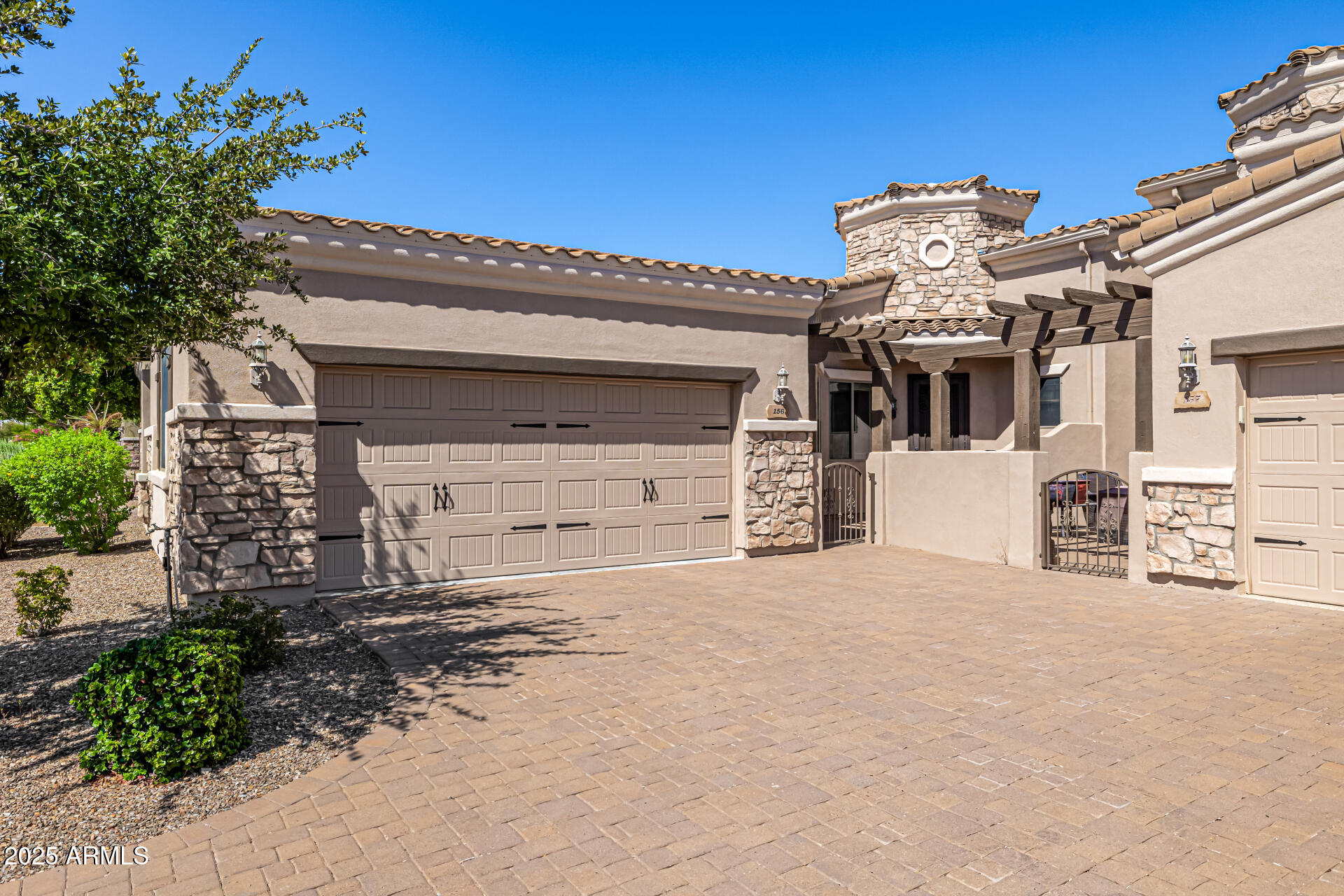 6202 East McKellips Road, Unit 156 Mesa, AZ 85215 - Photo 6 of 57 a front view of a house with a yard