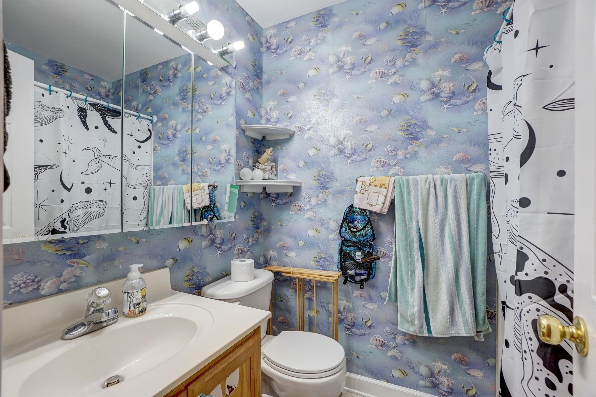 4816 Elmhurst Ridge Court Raleigh, NC 27616 - Photo 11 of 27 a bathroom with a sink toilet and shower