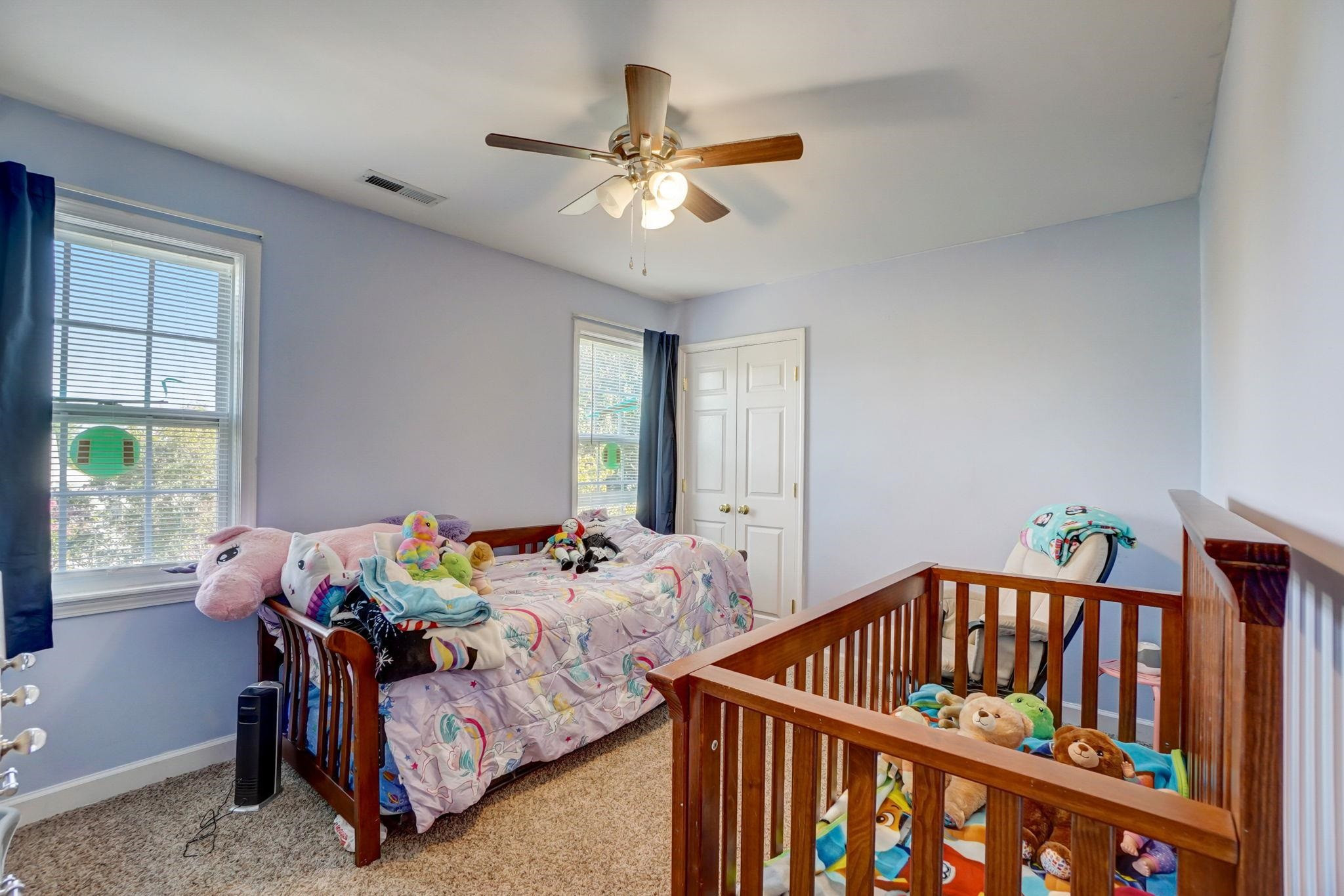 4816 Elmhurst Ridge Court Raleigh, NC 27616 - Photo 12 of 27 a bedroom with furniture and a window