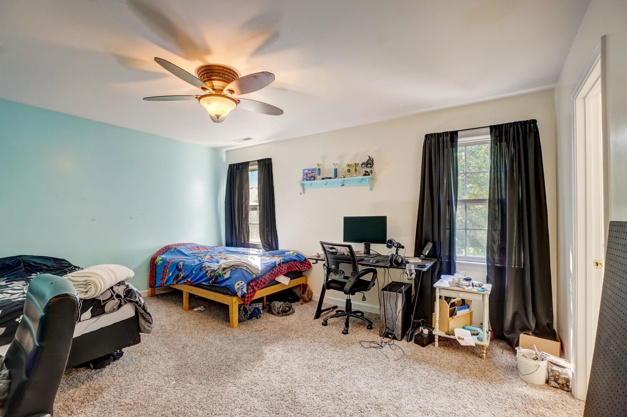 4816 Elmhurst Ridge Court Raleigh, NC 27616 - Photo 13 of 27 a bedroom with bed and a window