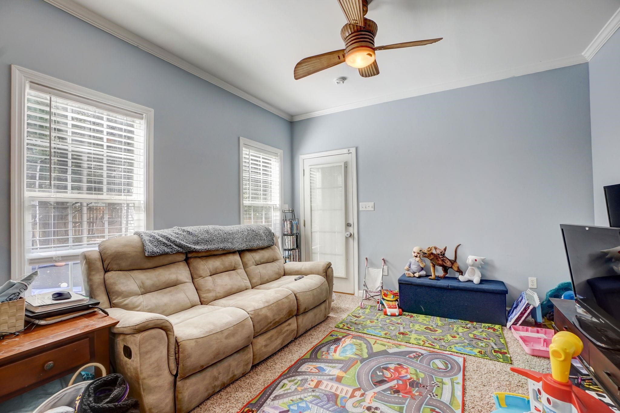 4816 Elmhurst Ridge Court Raleigh, NC 27616 - Photo 19 of 27 a living room with furniture and a window